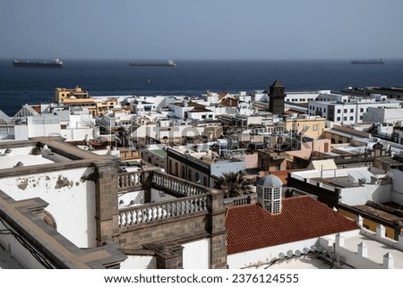 Cityscape of Las Palmas de Gran Canaria, on the island of Gran Canaria, Spain, with traditional buildings and the blue of the Atlantic ocean in the background, as photographed in winter