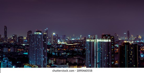 Cityscape Of Modern Building In The Night. Modern Architecture Office Building. Skyscraper With Beautiful Evening Sky. Business And Financial Center Building. Apartment In The City With Night Light.