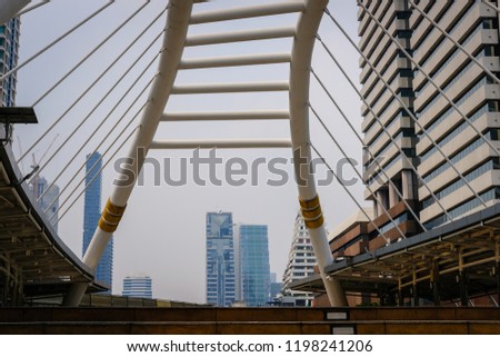 cityscape of modern office building & bridge at Chong Nonsi station of bts sky train mass transit system in Bangkok, Thailand