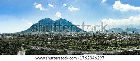 Cityscape of Monterrey Nuevo Leon Mexico sunny day blue sky Cerro de la silla
