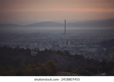 Cityscape in morning light and morning fog. Stunning, soft view of purple blue hour sky above scenic cityscape covered by haze and mist.  - Powered by Shutterstock