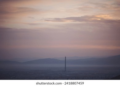 Cityscape in morning light and morning fog. Stunning, soft view of purple blue hour sky above scenic cityscape covered by haze and mist.  - Powered by Shutterstock