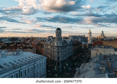 Cityscape of Neoclassicism residential house with tower on Five Corners square in St Petersburg, Russia. Cloudy sunset sky. Beautiful landscape. Vladimirsky Cathedral on background. Travel destination