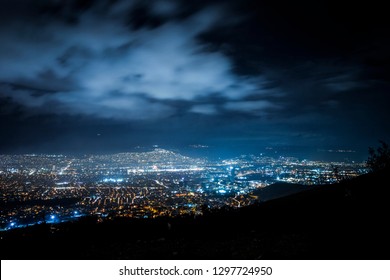 Cityscape at night. Cloudy night sky. - Shutterstock ID 1297724950