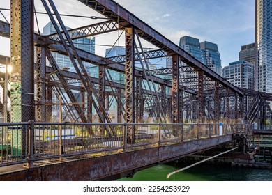 Cityscape of an old abandoned truss bridge in the bay on the modern Boston waterfront combined with urban new glass skyscrapers and colonial bricks buildings in Massachusetts in New England - Shutterstock ID 2254253929