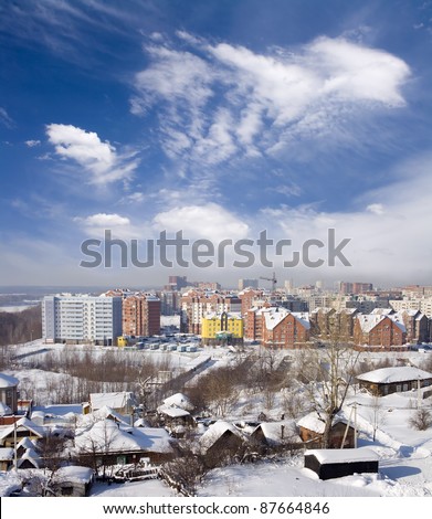Cityscape of old and new district. Winter town