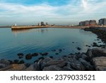 Cityscape of Oostende (Ostend) with pier and modern apartment buildings at sunset, Belgium.