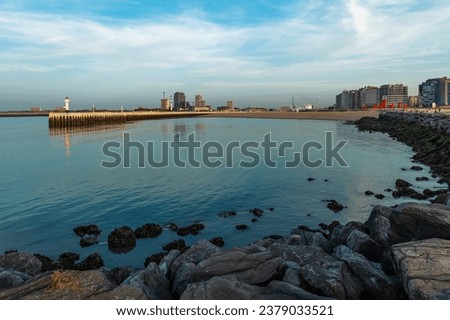 Cityscape of Oostende (Ostend) with pier and modern apartment buildings at sunset, Belgium.