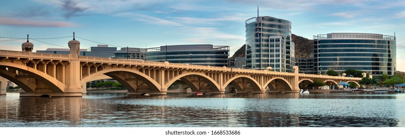 Cityscape panoramic shore view of downtown Tempe Arizona USA over the Salt River and Mill Avenue Bridge
