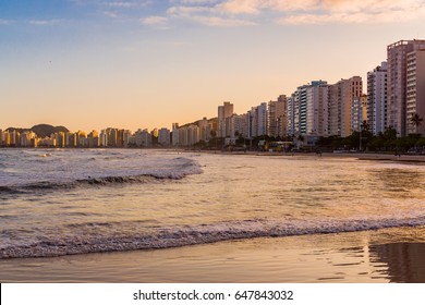 Cityscape Of Pitangueiras Beach, Guarujá, São Paulo, Brazil, With Upscale Condos At Sunset