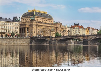 Cityscape of Prague with national theater and river Vltava