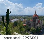 A cityscape with a red dome church in San Miguel Chapultepec