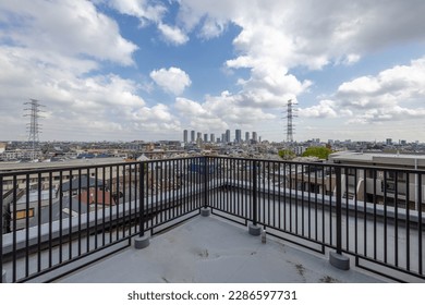 The cityscape seen from the veranda on the top floor of the housing complex - Shutterstock ID 2286597731