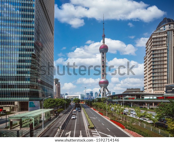 Cityscape of Shanghai city in day time with road\
and tower, Shanghai city,\
China