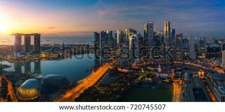 Cityscape of Singapore city sunrise and building in morning time, take photo from roof top bar in hotel