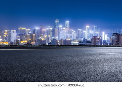 cityscape and skyline of downtown near water of chongqing at night - Shutterstock ID 709384786