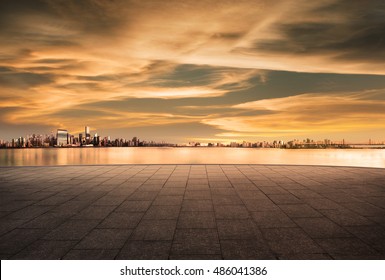 cityscape and skyline of downtown in sunset day on view from empty floor background - Powered by Shutterstock