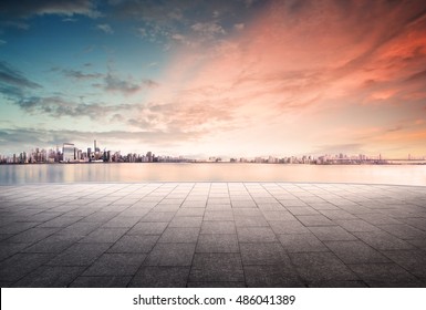 cityscape and skyline of downtown in sunset day on view from empty floor background - Powered by Shutterstock