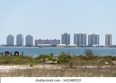 Cityscape, Skyline Of Navarre Beach City Town On Pensacola Bay Pcean Sea Coast Shore With Many High-rise Apartment Condo Condominium Buildings Towers In Florida Panhandle