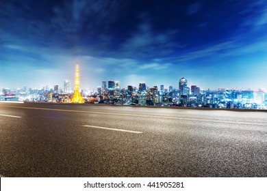 Cityscape And Skyline Of Tokyo On View From Empty Asphalt Street