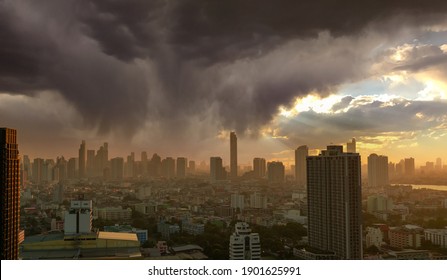 Cityscape with skyscraper building. Morning Sunlight through the sky with gray clouds. Riverfront city with golden sunrise. Urban modern building. Crowded with business and financial center building.