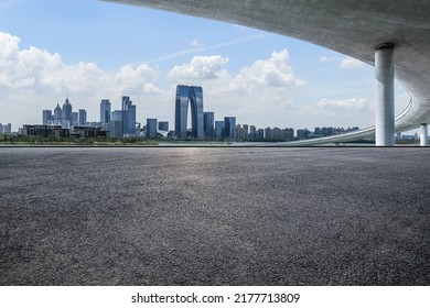 Cityscape of Suzhou City, Jiangsu Province, China. Asphalt road and modern city skyline scenery.