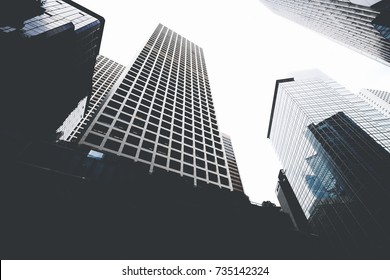 Cityscape View With Business Buildings With Contemporary Architecture In Metropolitan City In Day. High-rise Modern Skyscrapers In Big Town Against Grey Sky