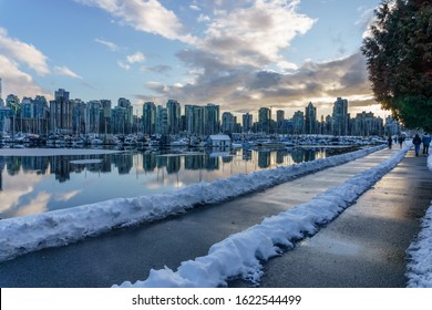 Cityscape View Of Vancouver Skyline And Seawall During Winter With Water Reflection, British Columbia, Canada.