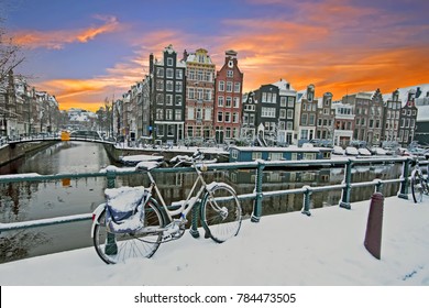Cityscenic from Amsterdam in winter in the Netherlands at sunset