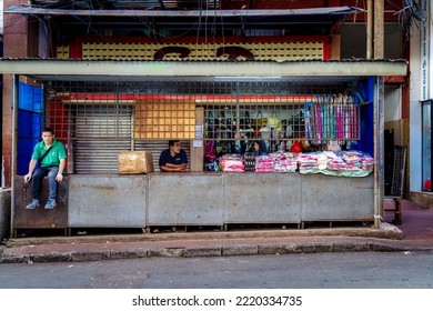Ciudad Del Este, Paraguay - July 27, 2022: Vendors Rest After Closing Their Clothing Stall In The City Market