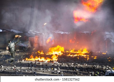 Civil conflict in society took the form of a violent confrontation between radical citizens of countries and the police and special forces, build barricades, burn tires and cars, throw stones - Shutterstock ID 1581327562