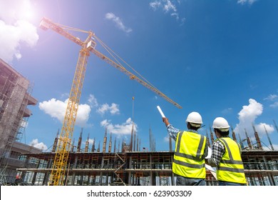 Civil Engineer Checking Work With Walkie-talkie For Communication To Management Team In The Construction Site