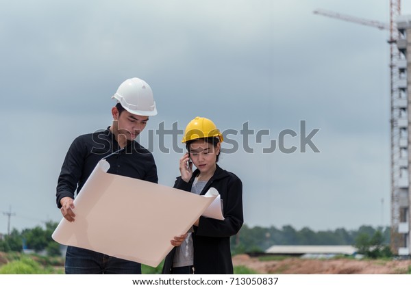 Civil Engineer Foreman Construction Site Inspecting Stock - 