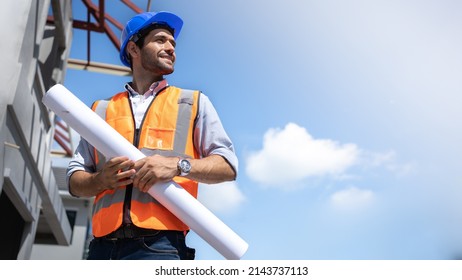 Civil Engineer Hispanic smiling and Constuction backgrounds  use for banner cover  Success in target project goal Handsome Middle Eastern worker 
