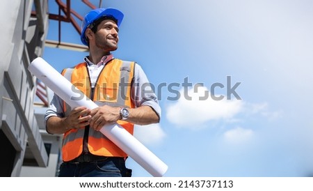 Civil Engineer Hispanic smiling with Constuction backgrounds, use for banner cover. Success in target of project goal Handsome Middle Eastern worker.