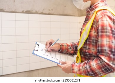Civil Engineer Inspector Or Auditor  Wear Mask Work In Construction Site To Control Planning And Inspection Residential House Building Project Development With Control Checklist