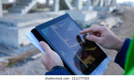 Civil Engineer Looking At Tablet At Construction Site