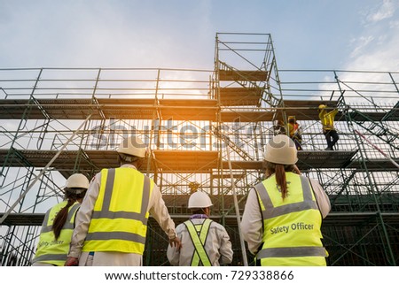 Civil engineer and safety officer in spec steel truss structure scaffolding risk analysis in construction site 