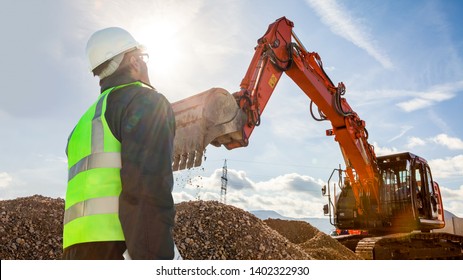 Civil Engineer Worker On Consstruction Site With Excavator Machine