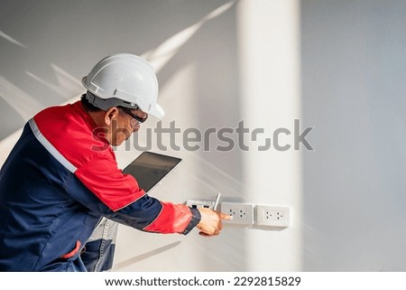 Civil engineer working with digital laser level tool in home interior design