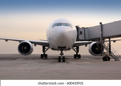 Civil Passenger Airplane Standing Near The Gate.