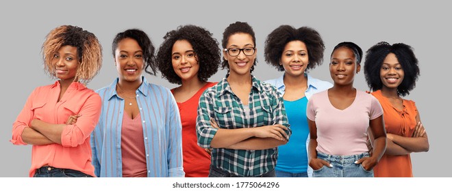 Civil Rights, Ethnicity And People Concept - Group Of Happy African American Women Over Grey Background