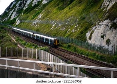 A Civil Train Crossing Countryside Trough Hills