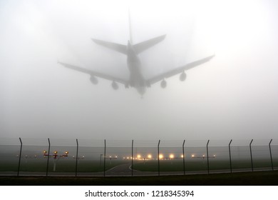 Civil wide-body airliner landing in fog.