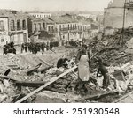 Civilians in Madrid search through the rubble of their homes in 