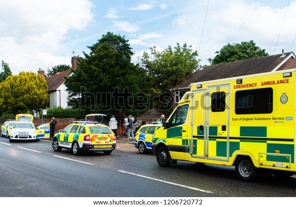 Clacton on Sea, Essex - 1st August 2016 - Emergency\
services on scene at a drink driving accident with an over turned\
and injured driver, Police, ambulance paramedics and fire brigade\
attend the scene