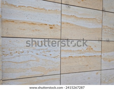 cladding of cut sandstone slabs with iron mapping. public buildings have cladding hung on the facade and tend to be under-ventilated