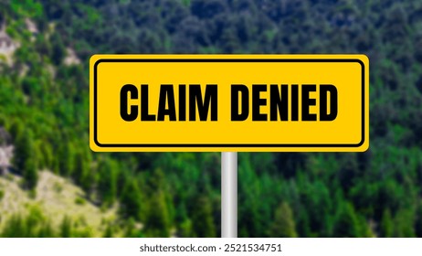 Claim denied message written on yellow metal sign  on nature background. Conceptual claim denied symbol. Copy space.