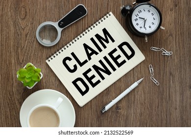 Claim Denied. Notepad On A Wooden Background With Text