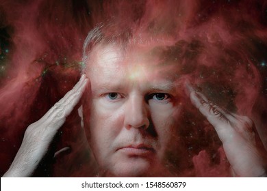 Clairvoyance, foresight, extrasensory perception, and paranormal abilities. Portrait of a man with bright yellow eyes. Elements of this image furnished by NASA